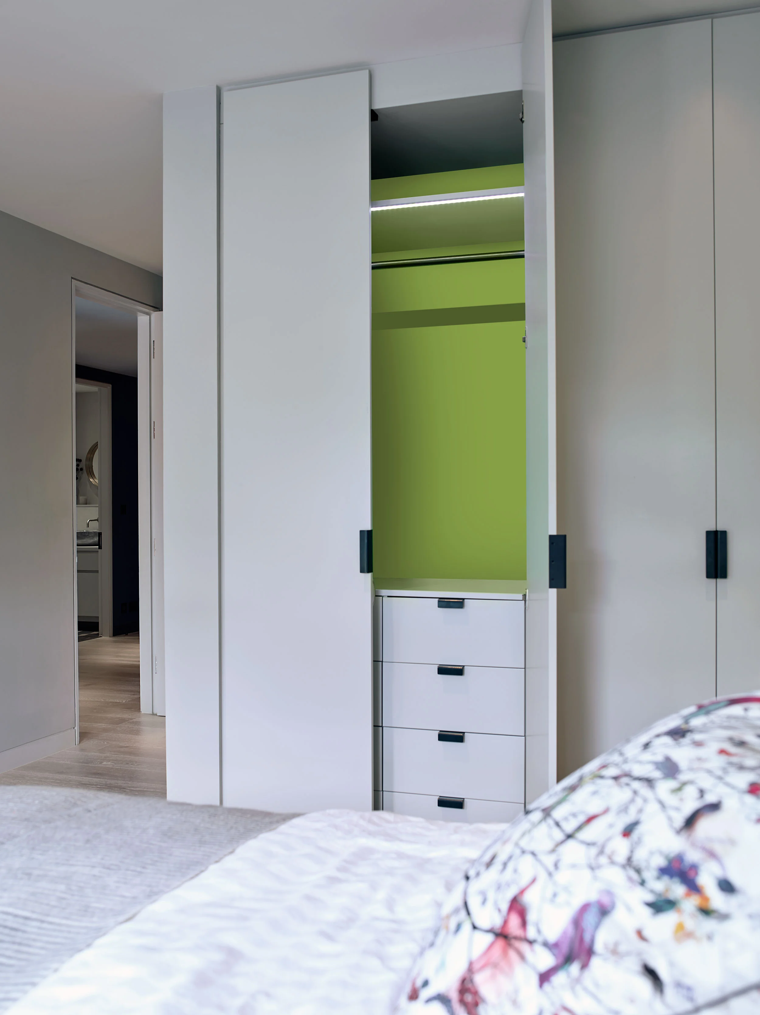 Bespoke bedroom joinery keep the master bedroom clear and uncluttered.