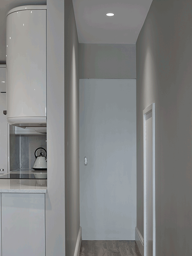 A series of sliding doors and a compact bathroom has been introduced at ground floor allowing the rear of the property to become a self-contained suite when guests stay overnight.