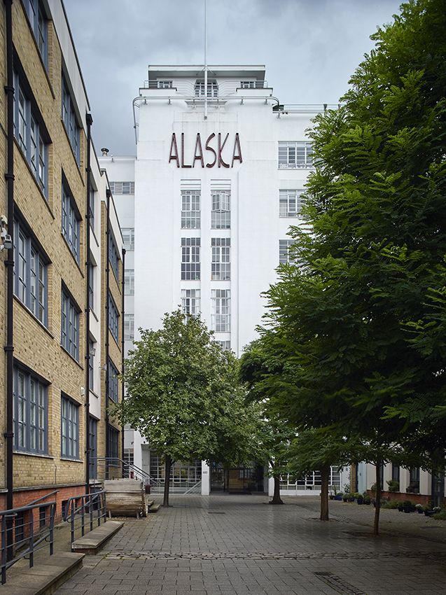 Alaska Buildings was originally built in 1869 as a factory to work imported seal skins from Antarctica, and later from Alaska and Canada. In 1930 architect Wallis Gilbert designed the art-deco tower and extension which remains today.