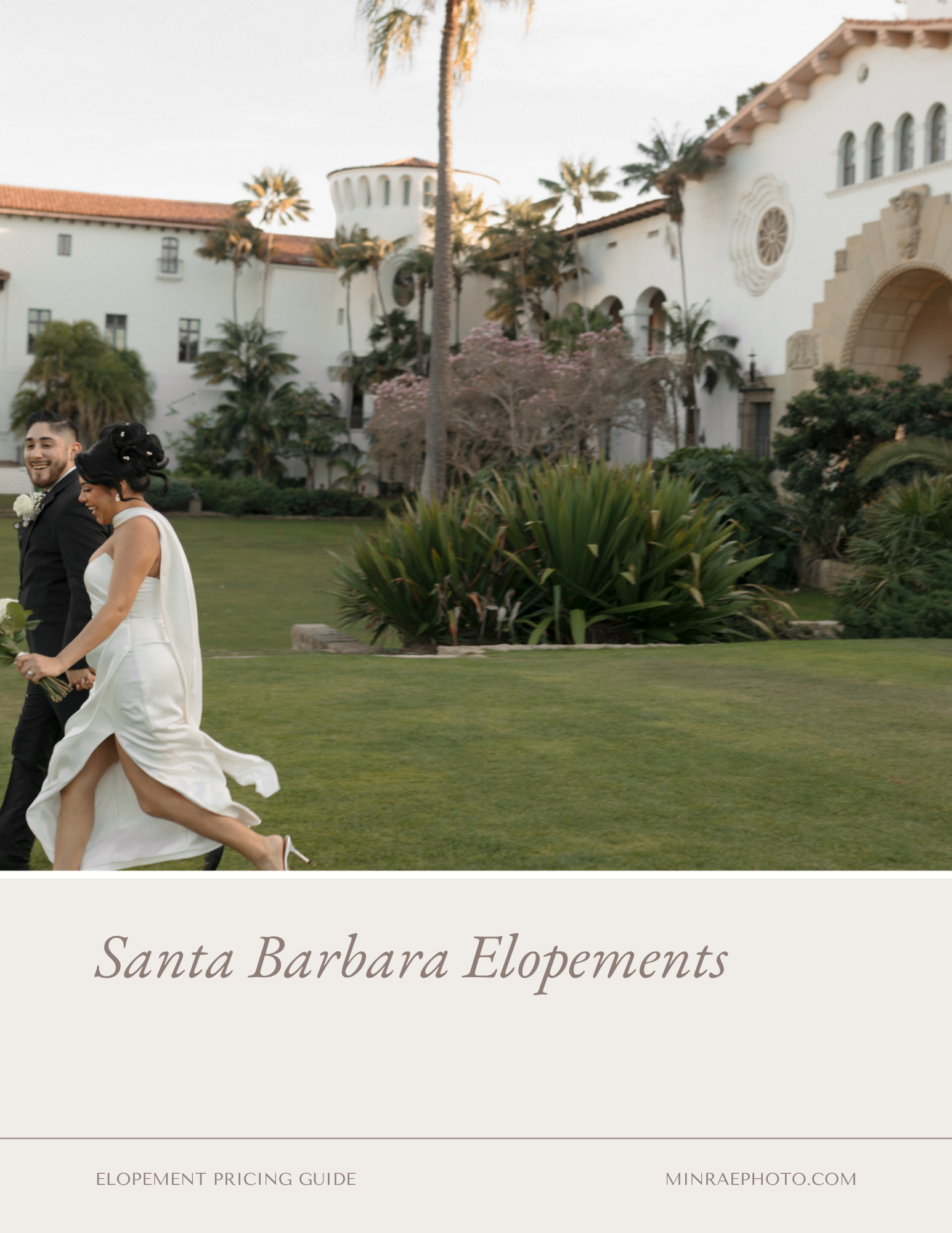 A bride and groom walking on a lawn in front of Santa Barbara Courthouse, smiling and holding hands, with the courthouse building and palm trees in the background.