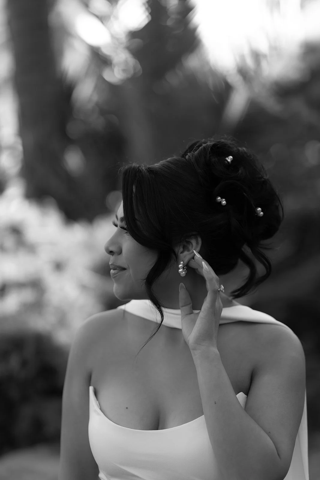 Black and white side profile close-up of bride from neck up during elopement at the Santa Barbara Courthouse Sunken Gardens