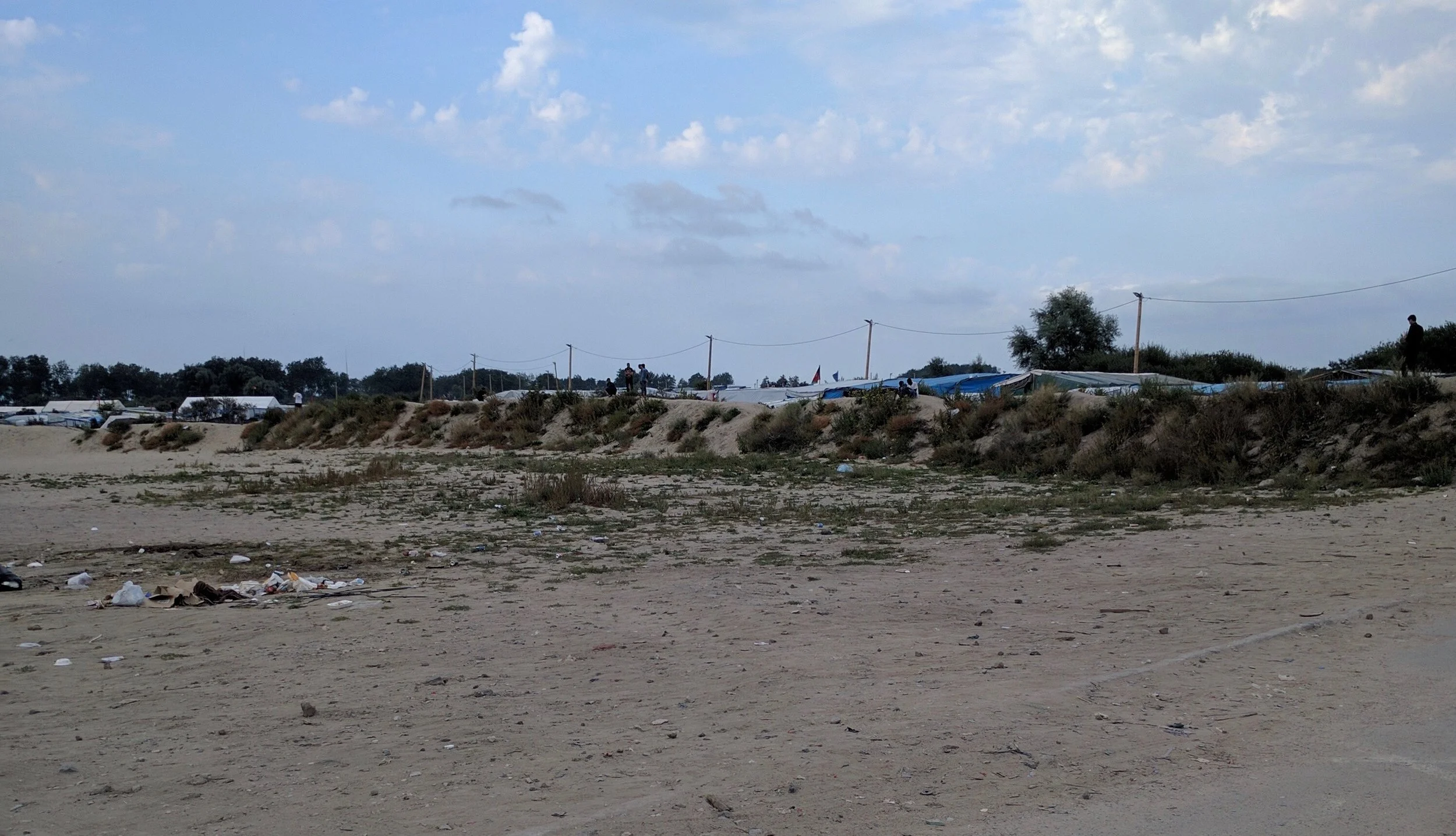 A view into the camp from the motorway side - low, sandy and few trees, yet known as The JUngle