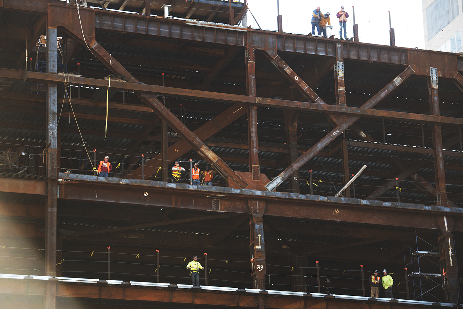 construction workers looking down at a crime scene where Police found a deceased person in a manhole. Manhattan, NY. 2015 © Go Nakamura photography