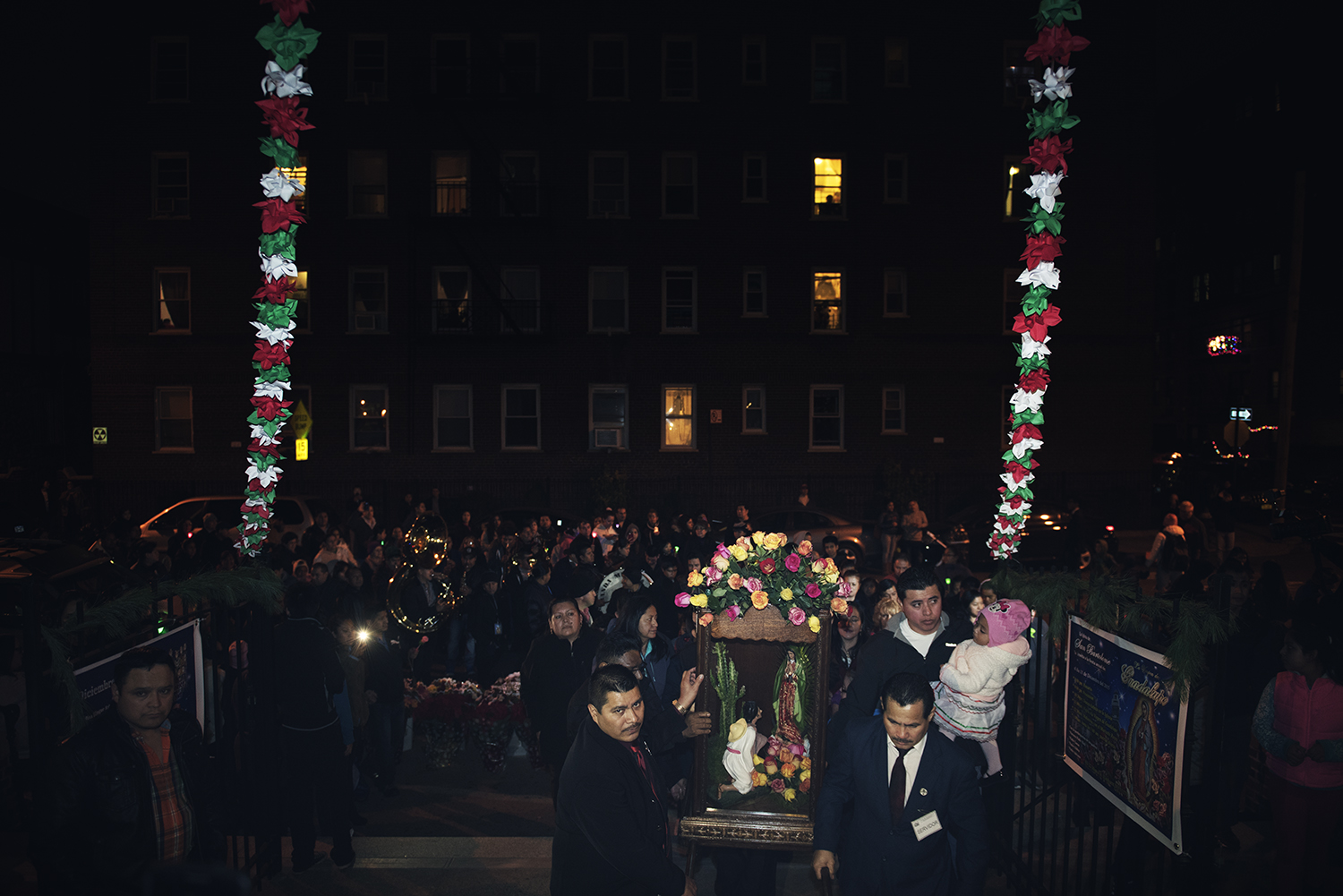 People carry a statue of Virgin Mary in a case to celebrate Feast of Our Lady of Guadalupe in Queens, NY. 2015 © Go Nakamura photography