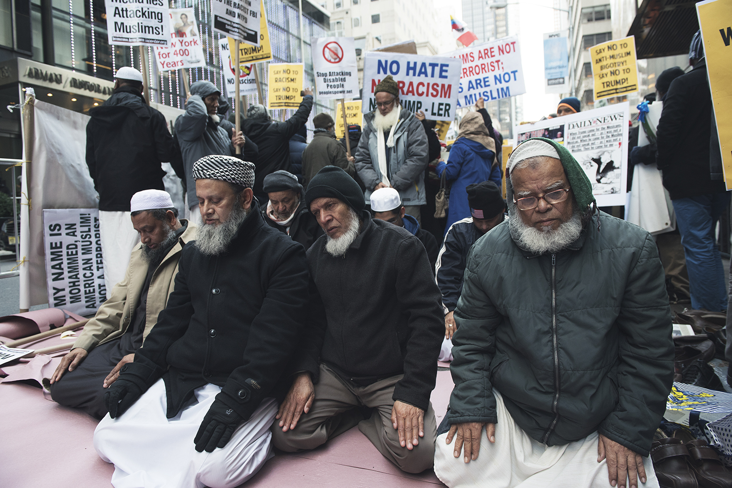 Muslim New Yorkers are at prayers during the p rotest against Donald Trump and Islamophobia. Manhattan, NY. 2015 © Go Nakamura photography