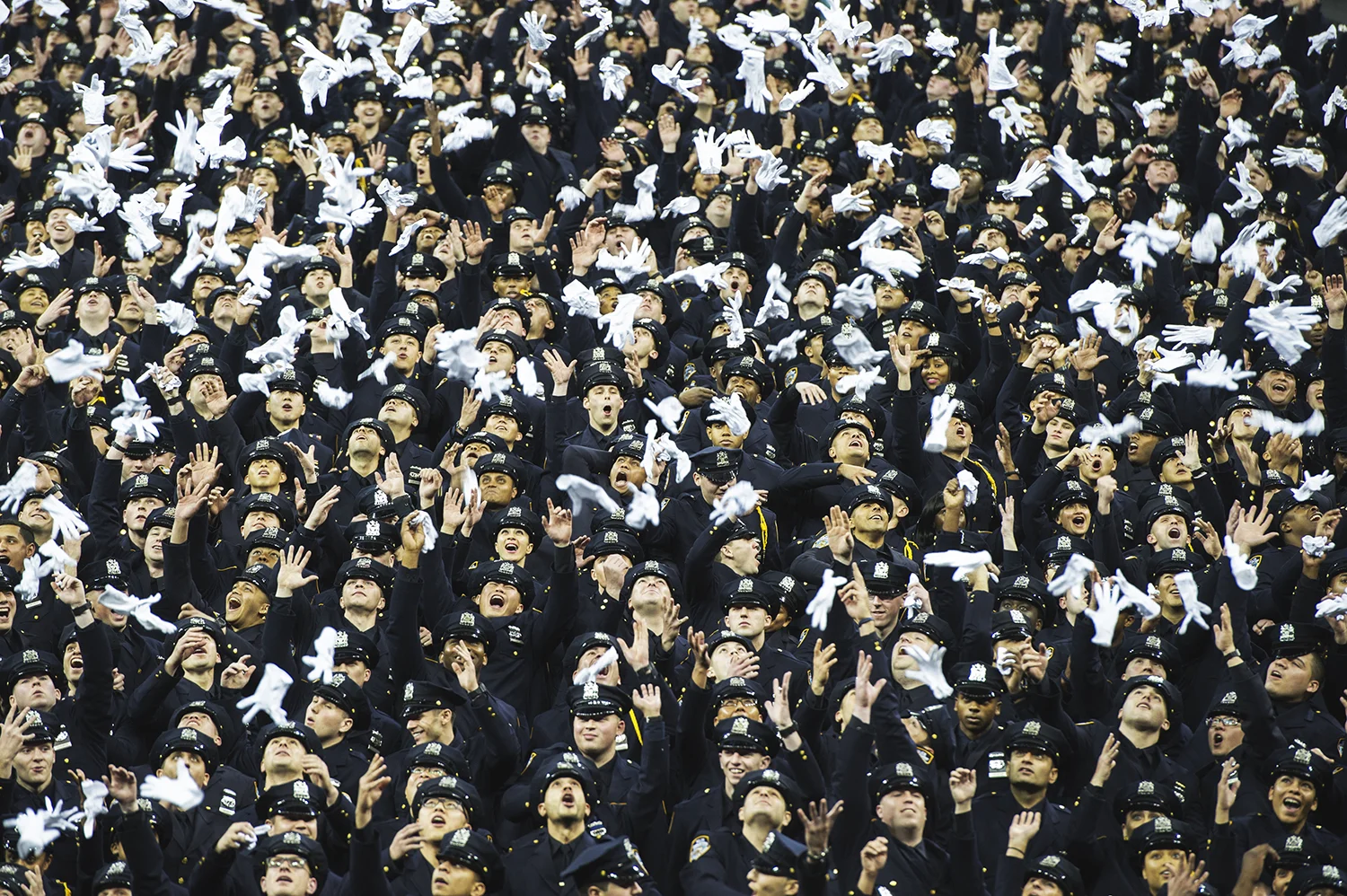 Police Academy graduates toss their cloves to celebrate The Annual Graduation Ceremony at Madison Sq Garden in Manhattan, NY. 2015 © Go Nakamura photography