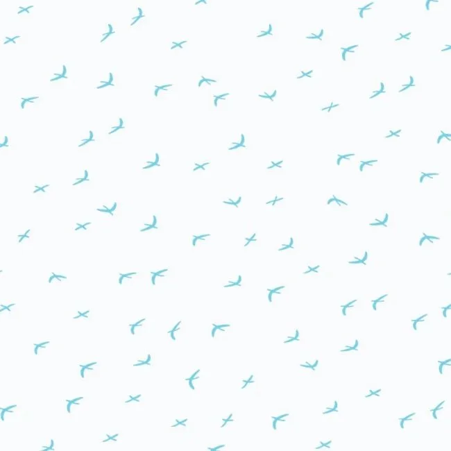 A pattern of small, light blue birds flying against a white background designed by surface pattern designer Gen Burgess.