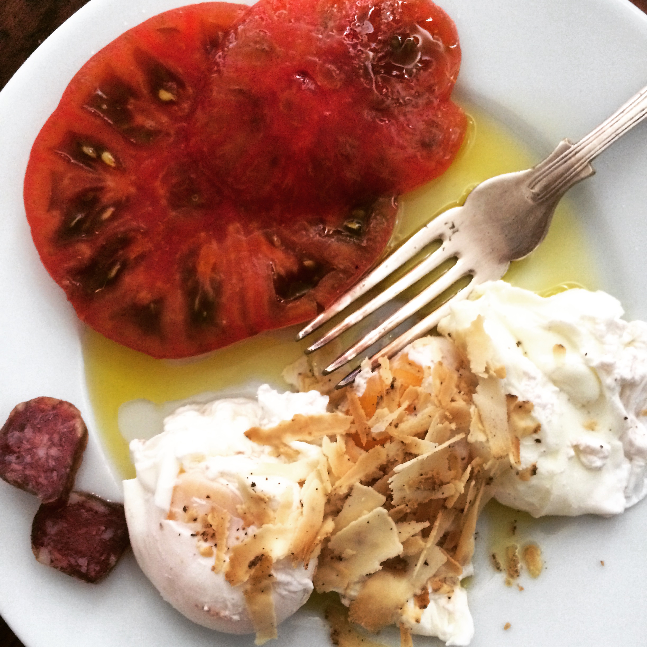 Ripe heirloom tomatoes, wild boar sausage and poached eggs with Belper Knole cheese