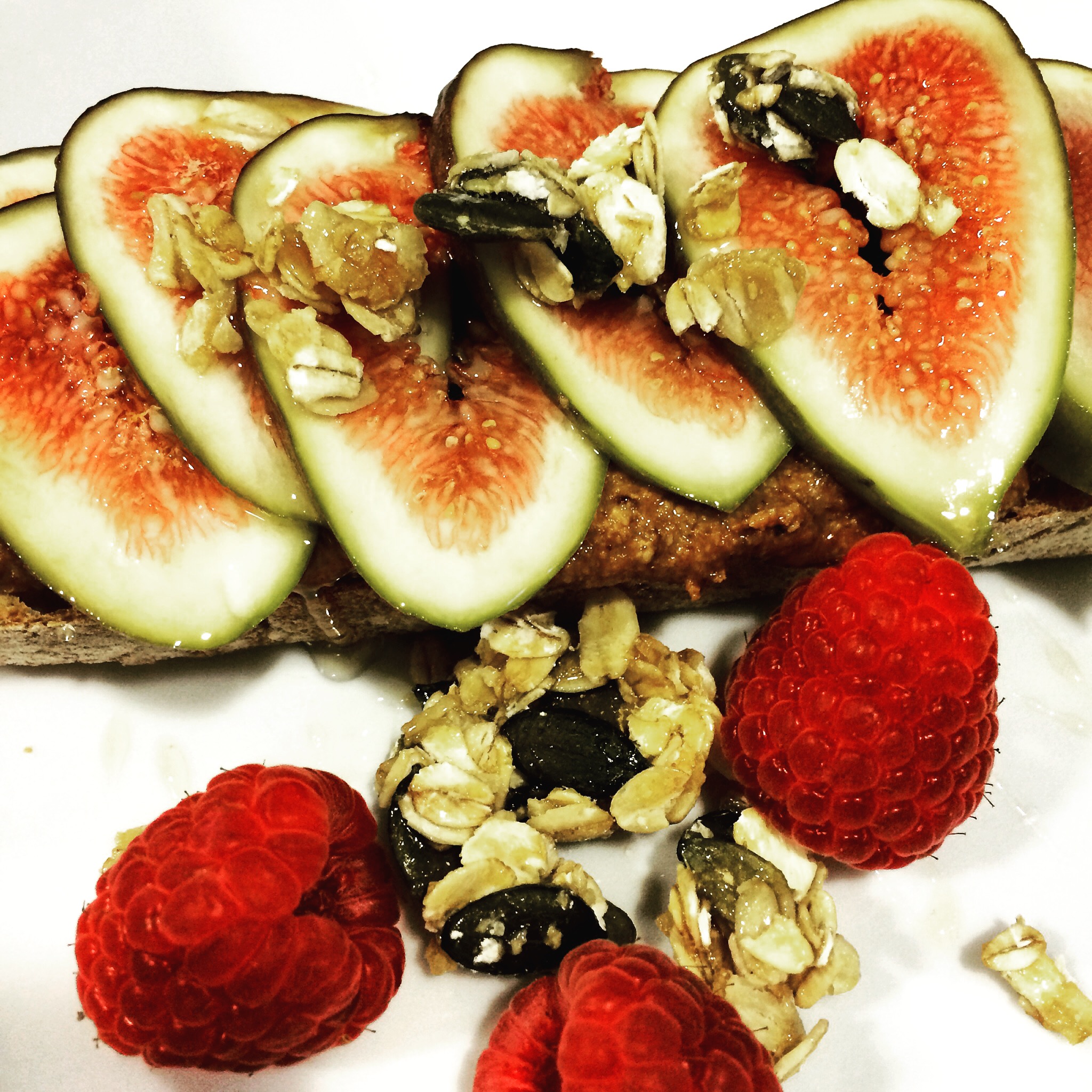 Homemade almond butter toast with fresh figs and granola
