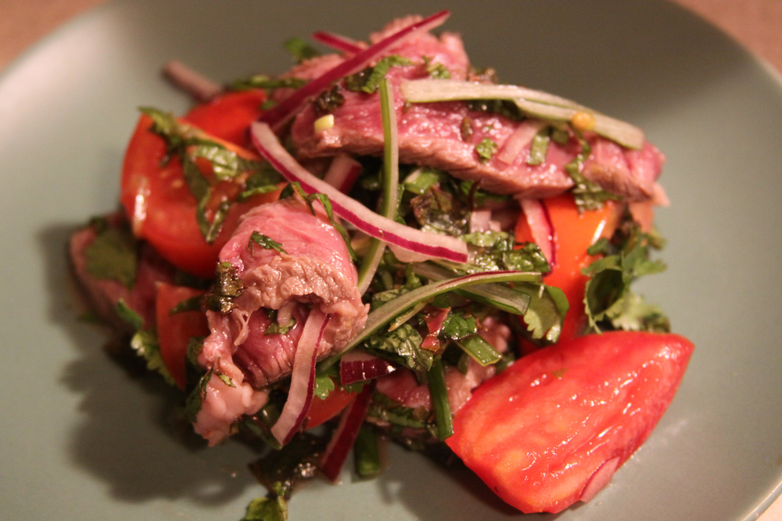 Spicy Thai Beef Salad with Wilted Coconut Lime Mustard Greens