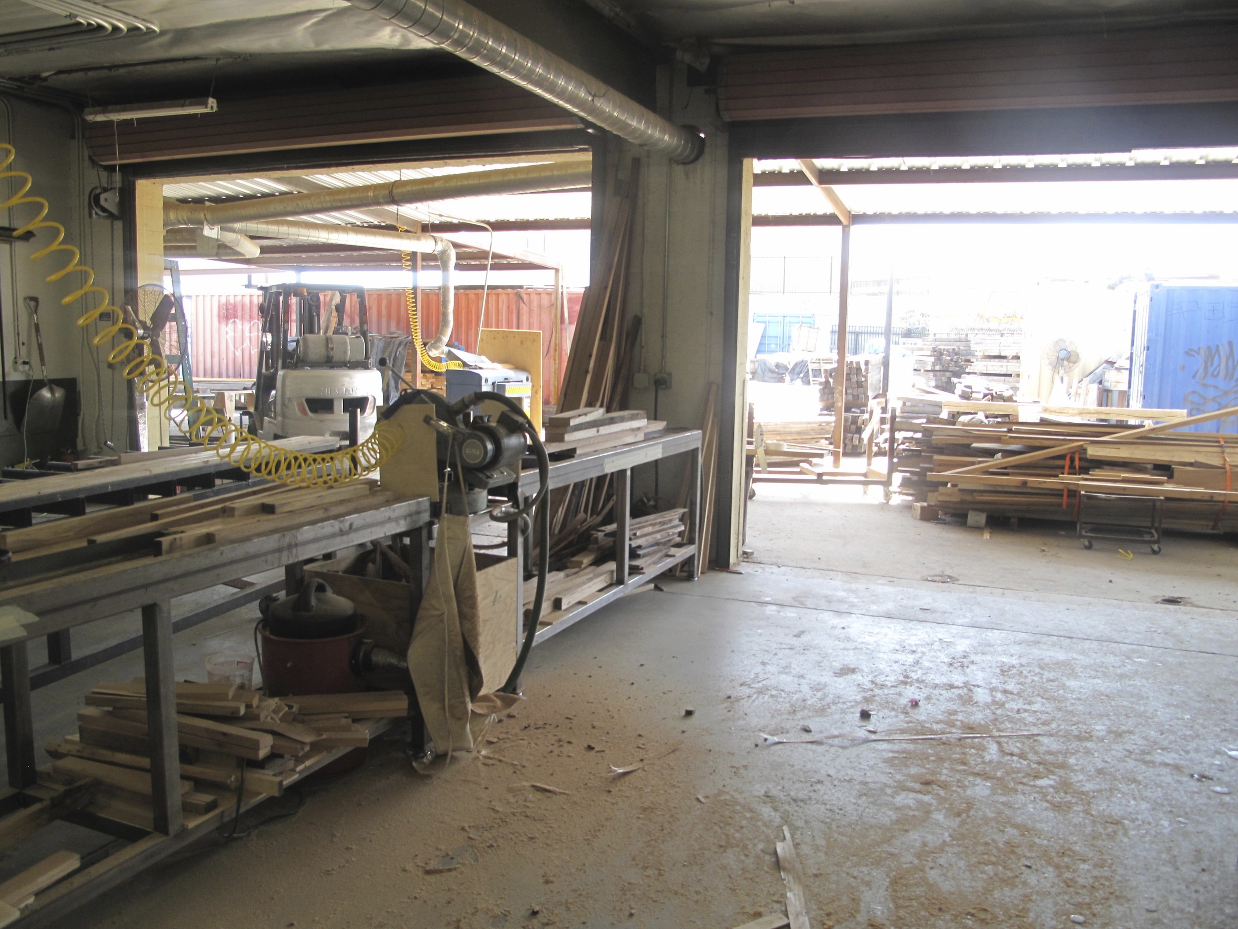 One section of the workshop, where wood was being prepped and furniture assembled.