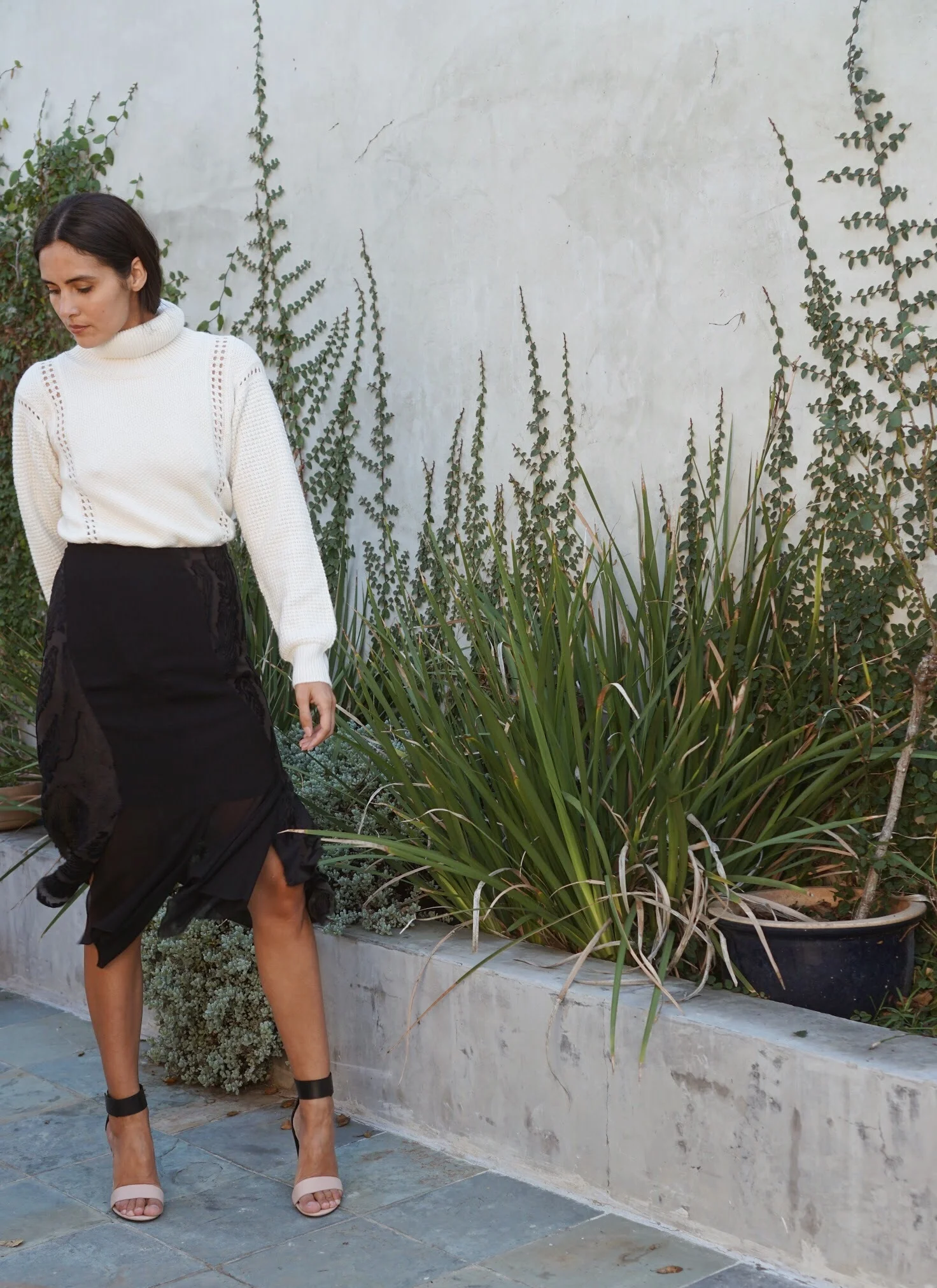Maiyet Turtleneck in Ivory + Maiyet Fil Coupe Panel Skirt in Black. 