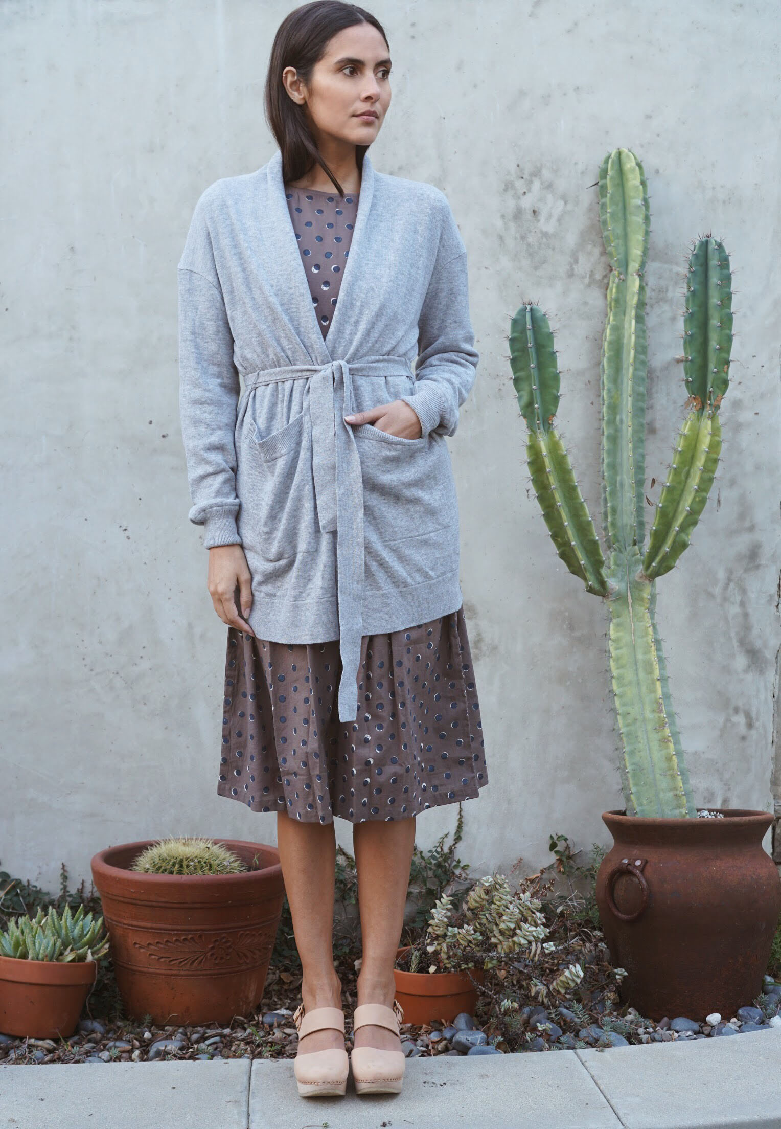 Kopal Kuku Dress in Block Polka + Maiyet Wrap Cardigan in Grey + Zuzii Closed Toe Clogs in Natural.