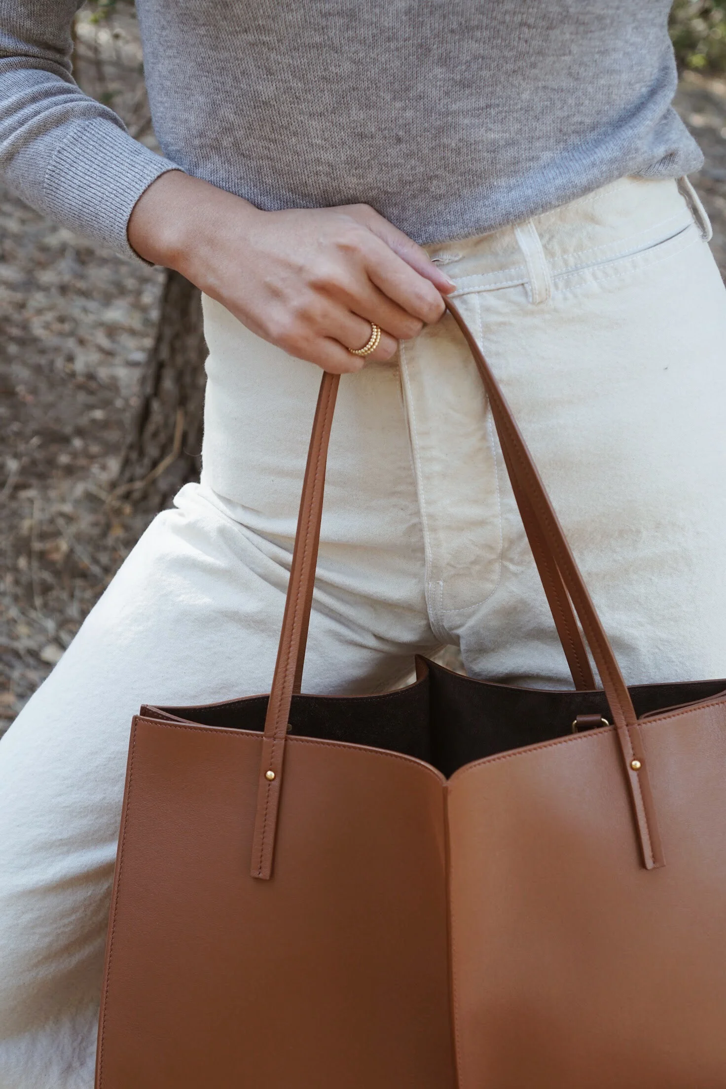 Lola Fenhirst Sybil Rings + Maiyet Cashmere Turtleneck Sweater in Grey + Maiyet Sia East/West in Cognac.