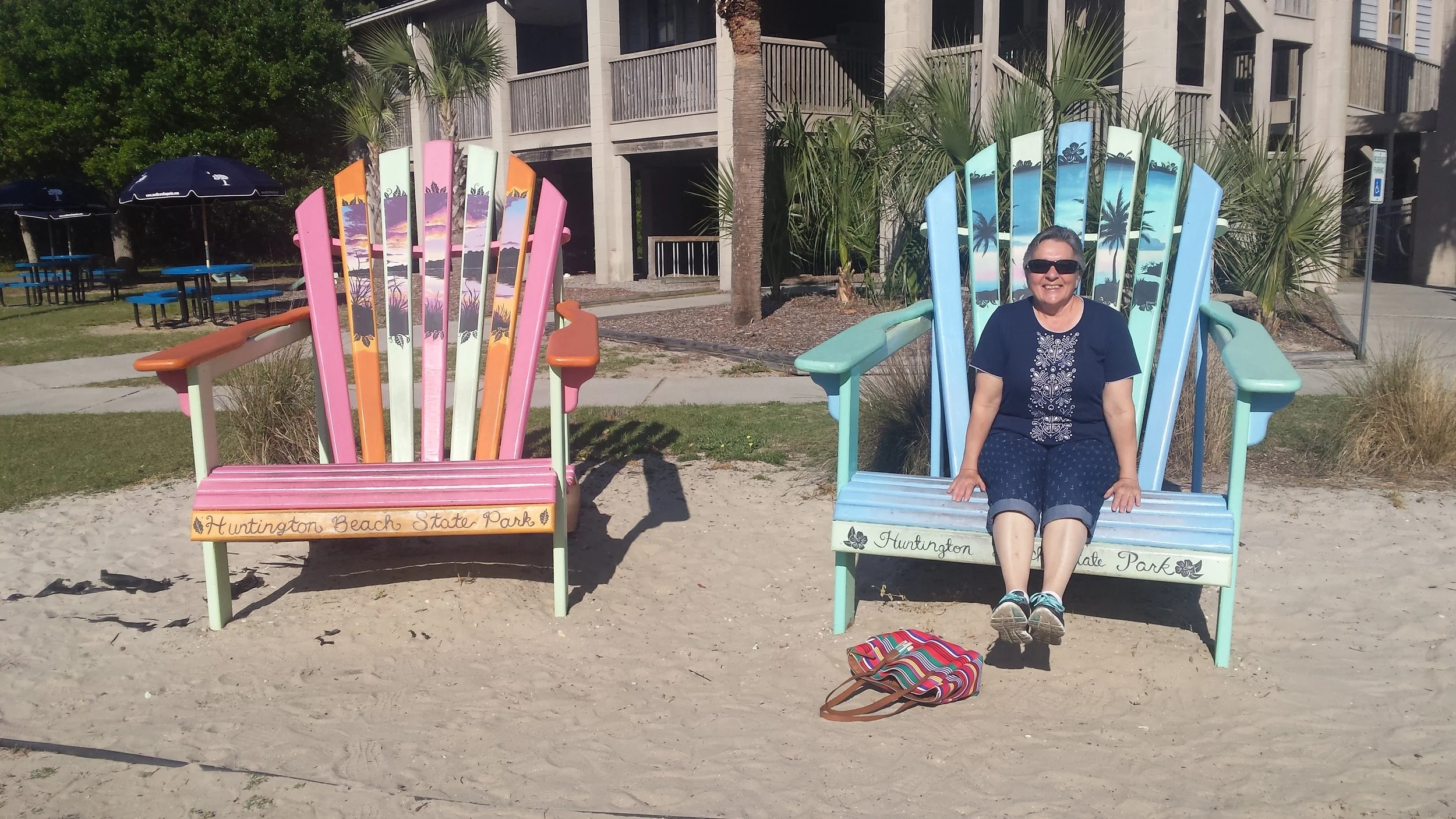 Beach Nana chilling in the giant adirondack chairs at Huntington Island State Park.