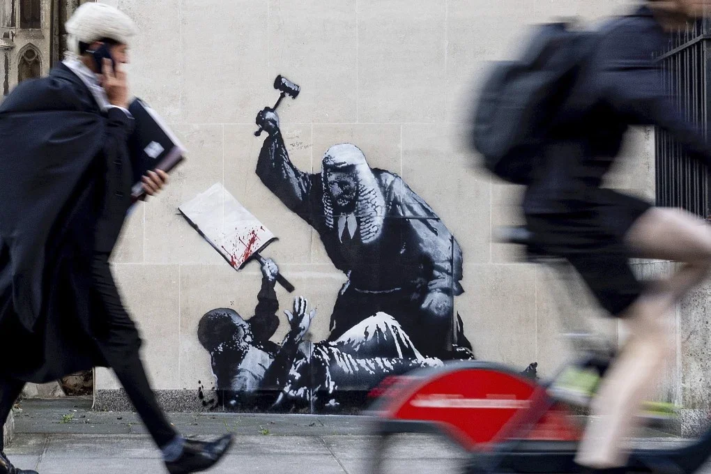 The Writing on the Wall: Investigation Unmasks Banksy’s True Identity