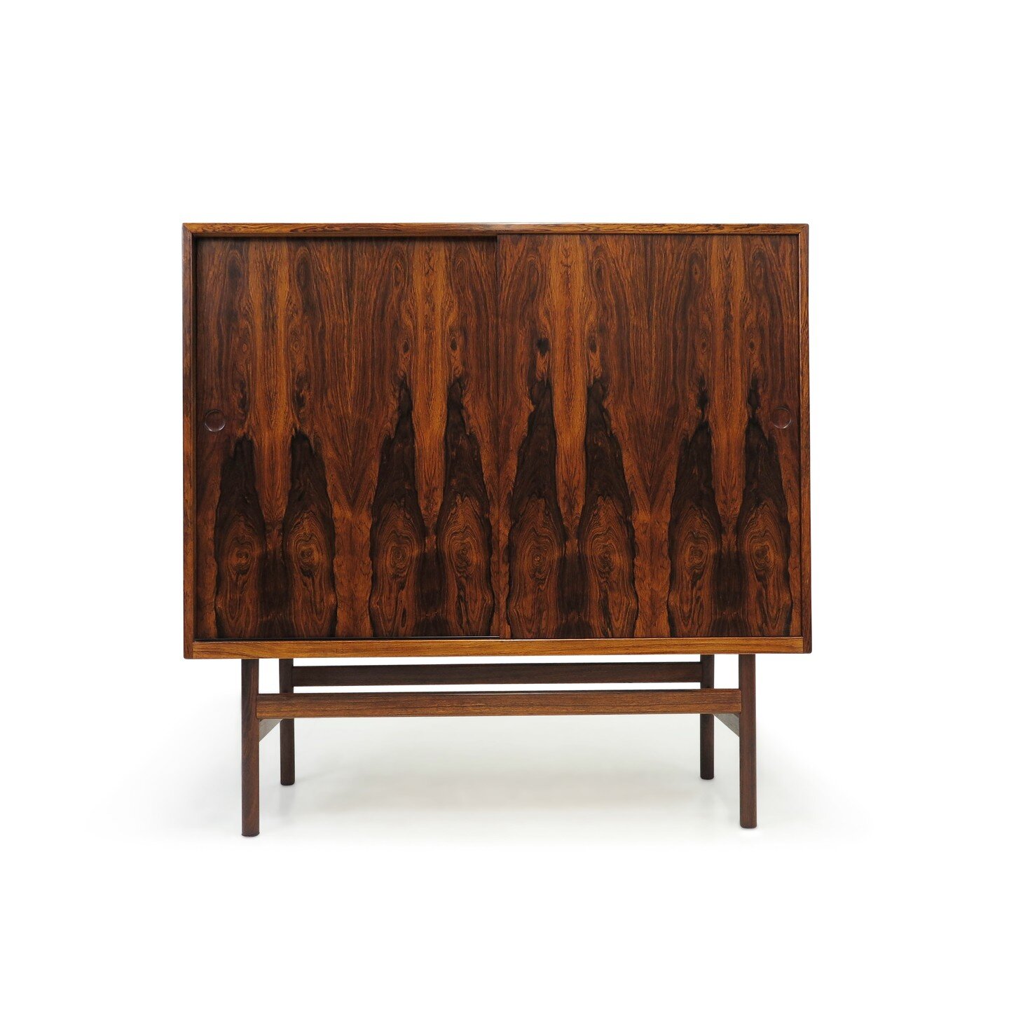Exquisite #danish #cabinet featuring #stunning #brazilian #rosewood doors with beautiful grain patterns. Opens to reveal a white #oak interior with silverware drawers and adjustable shelves. Meticulously handcrafted with attention to detail, showcasi