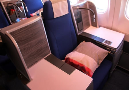 Business class seats transform into a lie-down bed at the flick of a switch. © Joanne DiBona
