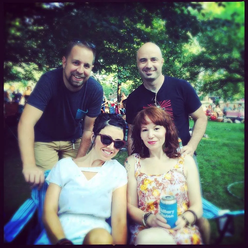 Andrew, Bender, Nicole, and Peanut celebrate a successful vintage yard sale