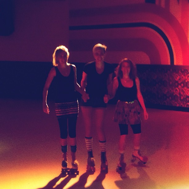 Christi, Christen, and Peanut roller skating at Peanut's 35th birthday party