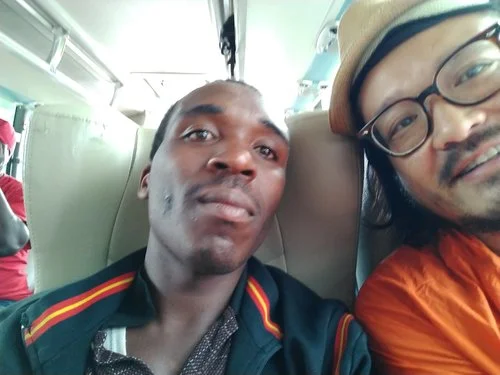 Chatting with my seatmate on a bus to Lake Kivu, Rwanda