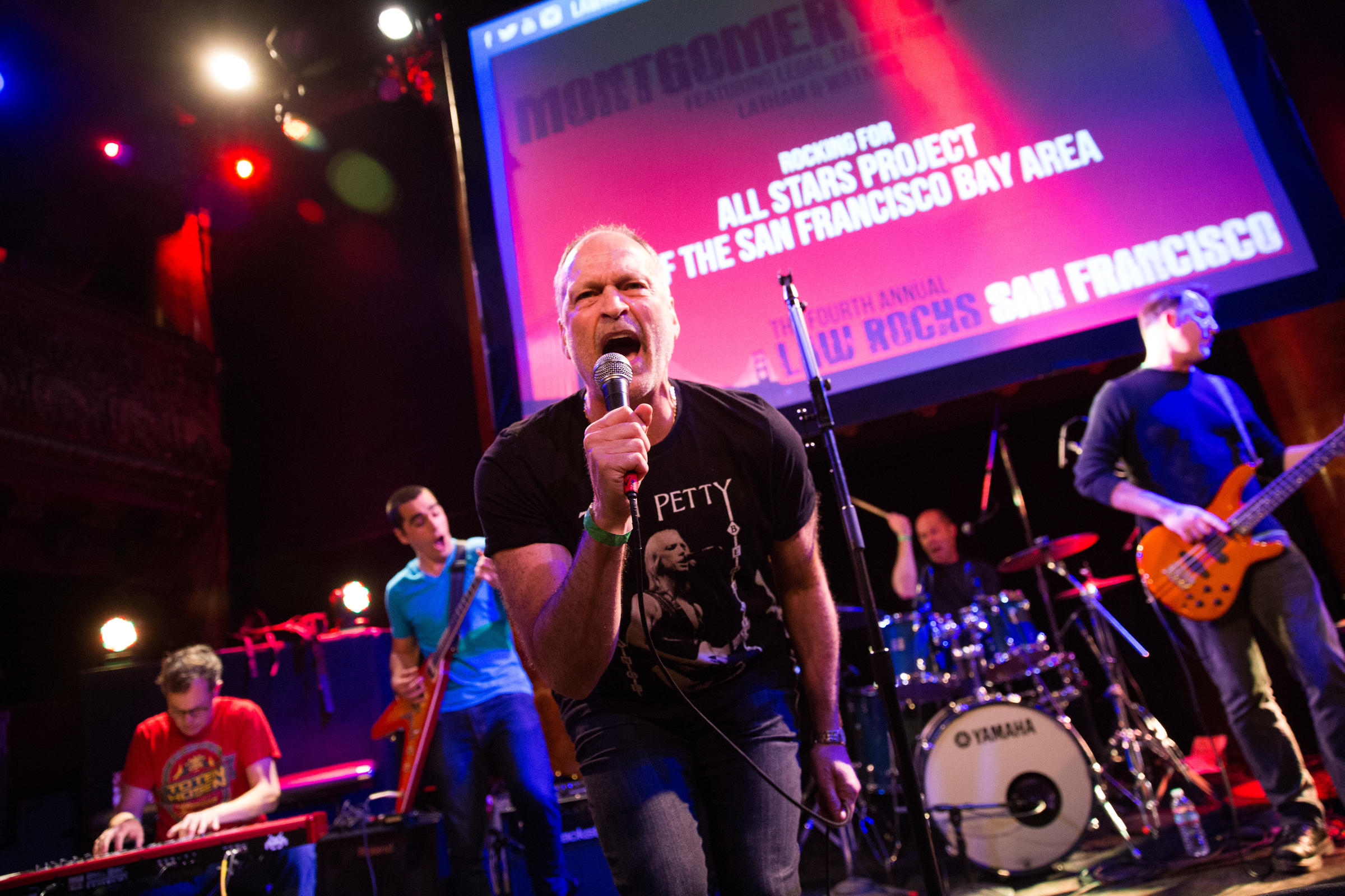 The lead singer of Montgomery Station (Latham & Watkins) interacts with the photographer at the Fourth Annual Law Rocks San Francisco as the band rocks for All Stars Project of the San Francisco Bay Area.