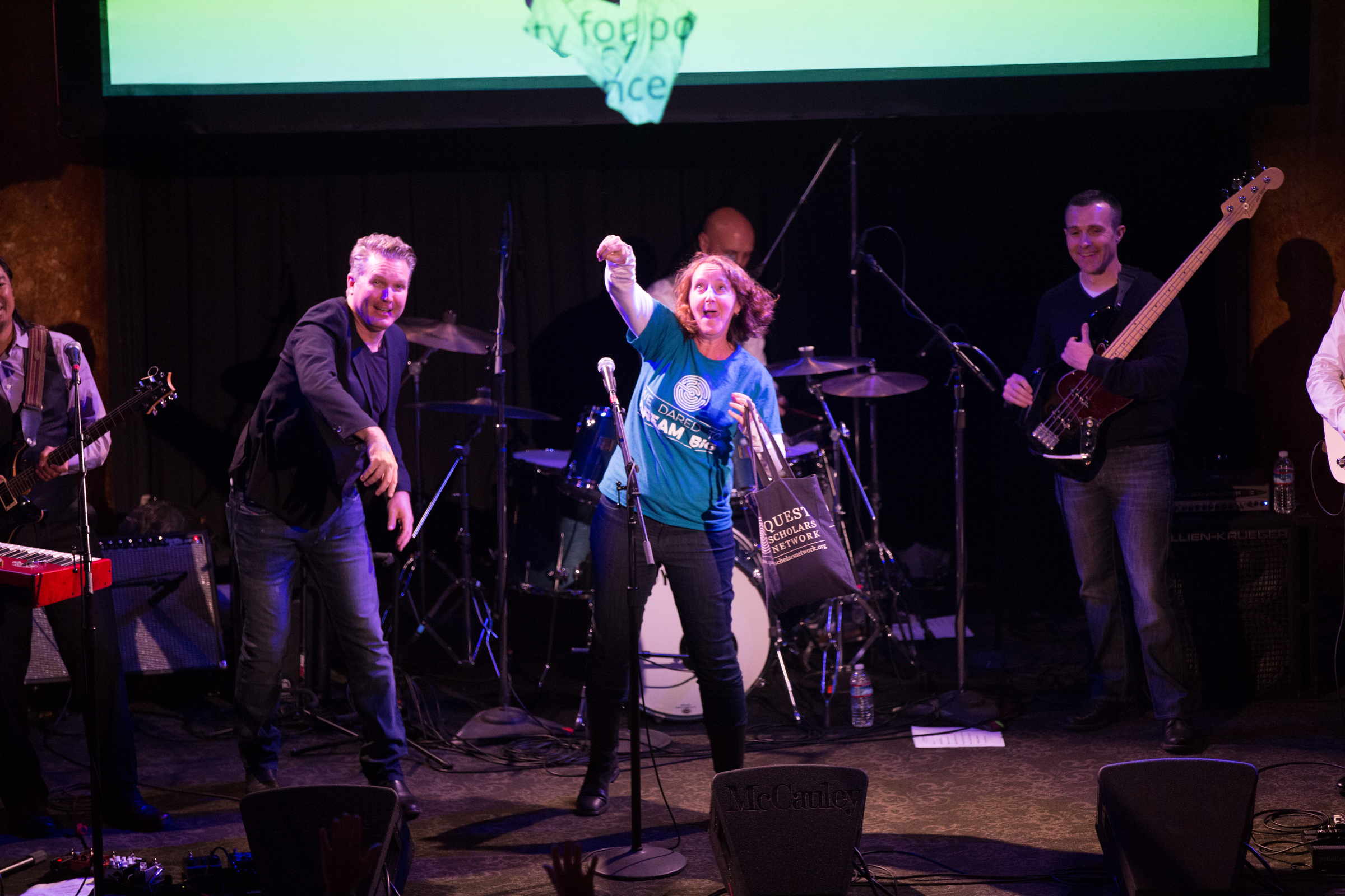 Here our Law Rocks SF emcee and the nonprofit representative from QuestBridge throw swag into the crowd. QuestBridge was the nonprofit pick of the humorously named LawrJe$$ & the Big Legal Instruments (Gibson, Dunn & Crutcher; King & Spalding; Mallari Advisory Services).