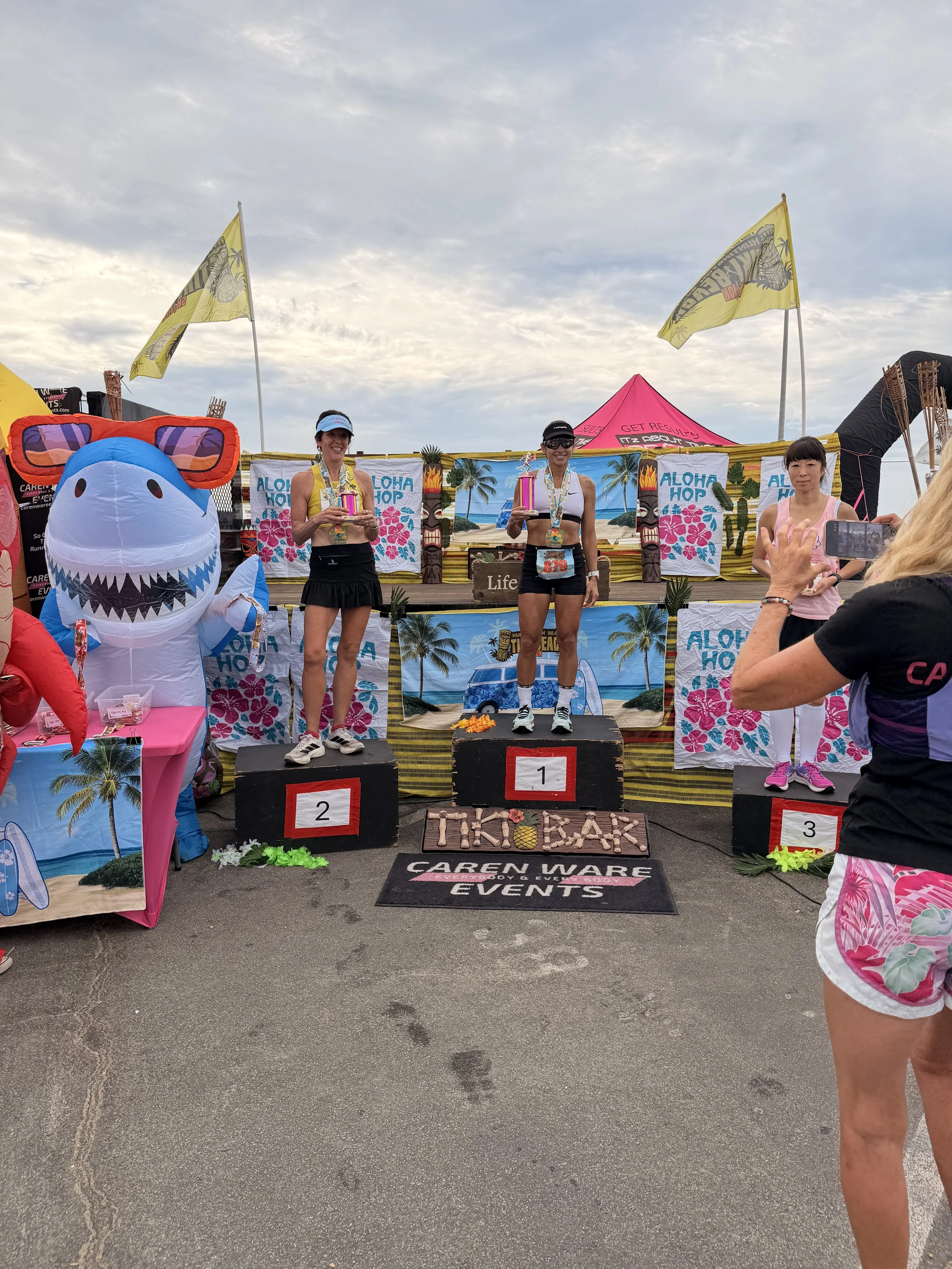  Lea Genders holding her 2nd overall female award at Tiki Beach 10K in Huntington Beach California 2026 