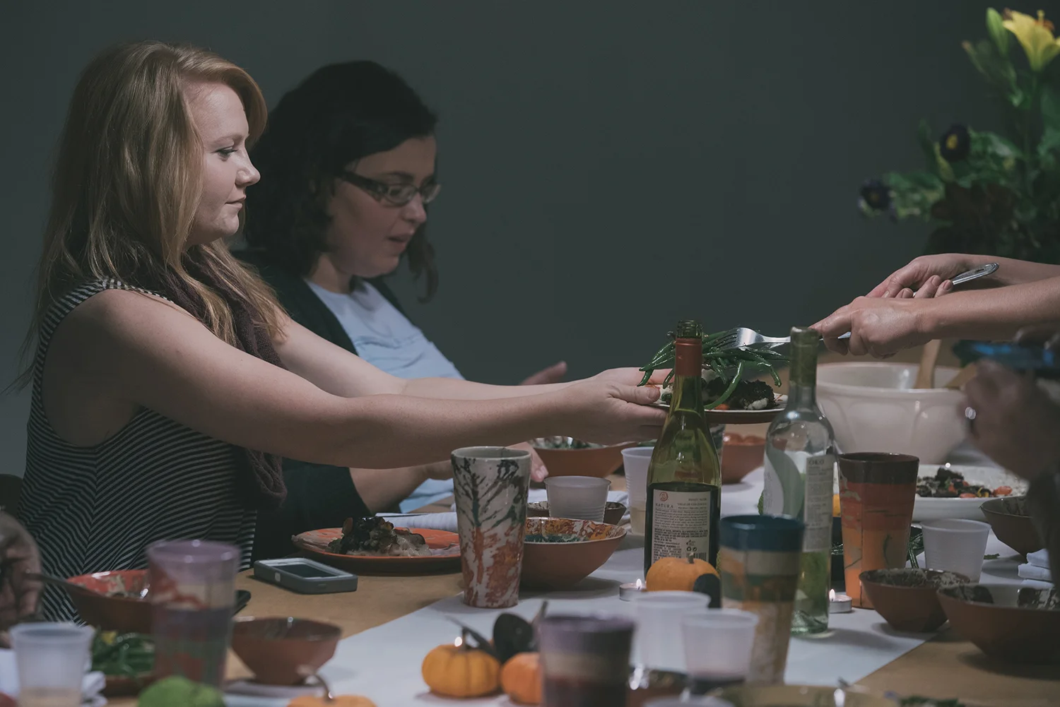 Serving each other as our first meal begins.