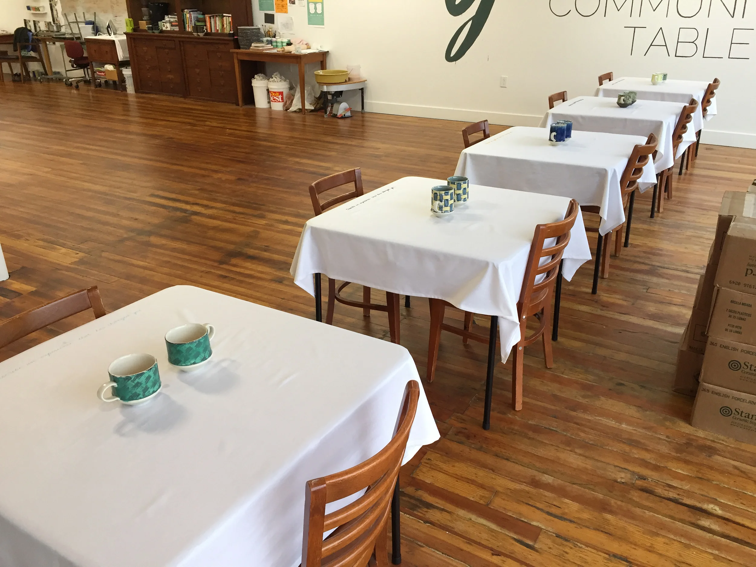  The five pairs of mugs and tablecloths ready for the first event. 