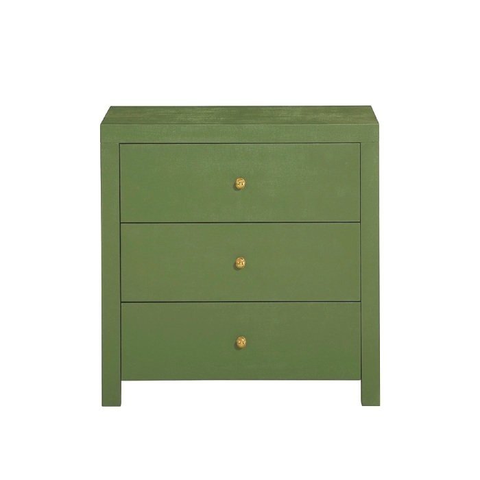 three drawer nightstand wrapped in green linen