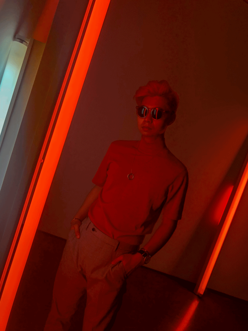 Dancing with a Dan Flavin signature neon piece.