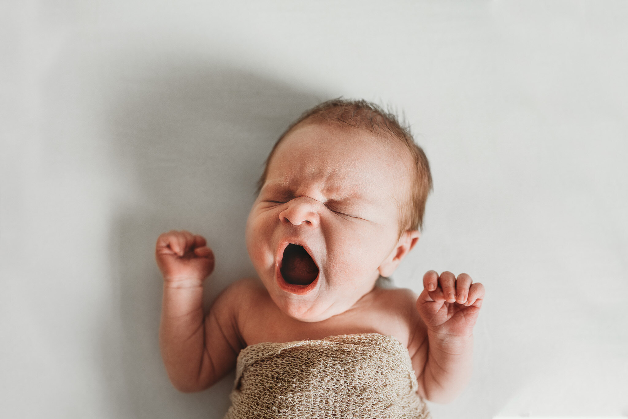 Newborn baby yawns