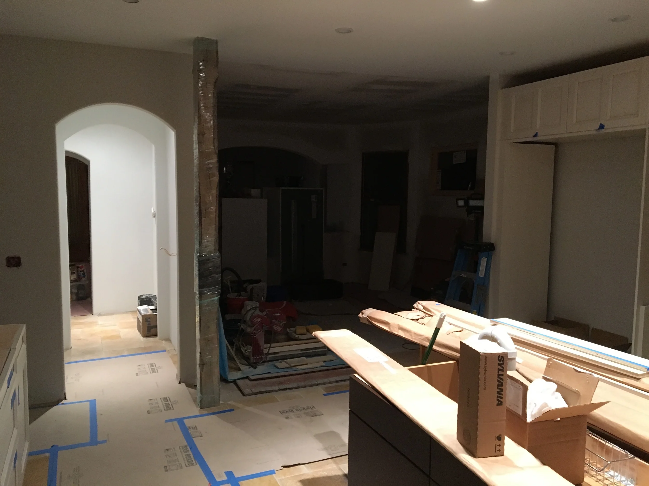 New arch openings with bullnose edges. And check out the structural reclaimed beam that supports the second floor with custom steel reinforcing plate,