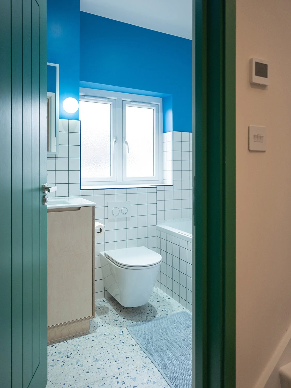 twickenham-renovation-bathroom-blue-walls-bathtub.jpg.jpg