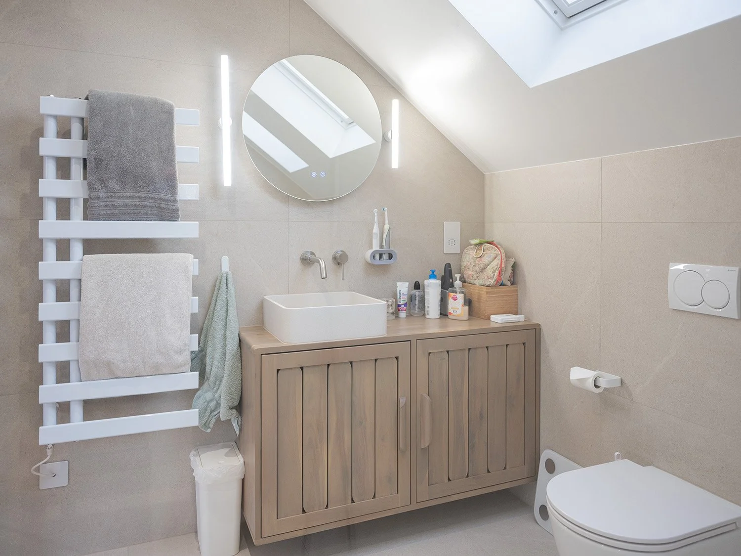 twickenham-renovation-bathroom-skylight-vanity-round-mirror.jpg.jpg