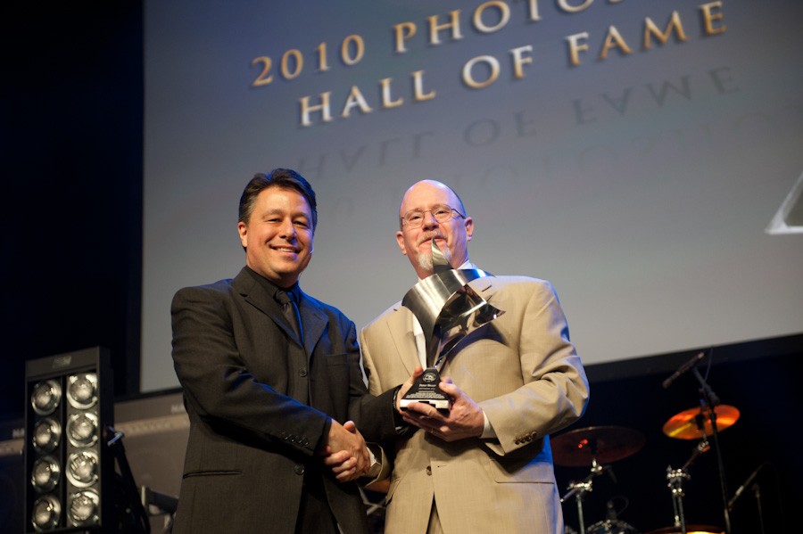 Peter (R) being presented with his award by KelbyOne's Larry Becker during the induction ceremony as part of the opening keynote presentation at the Photoshop World Conference & Expo