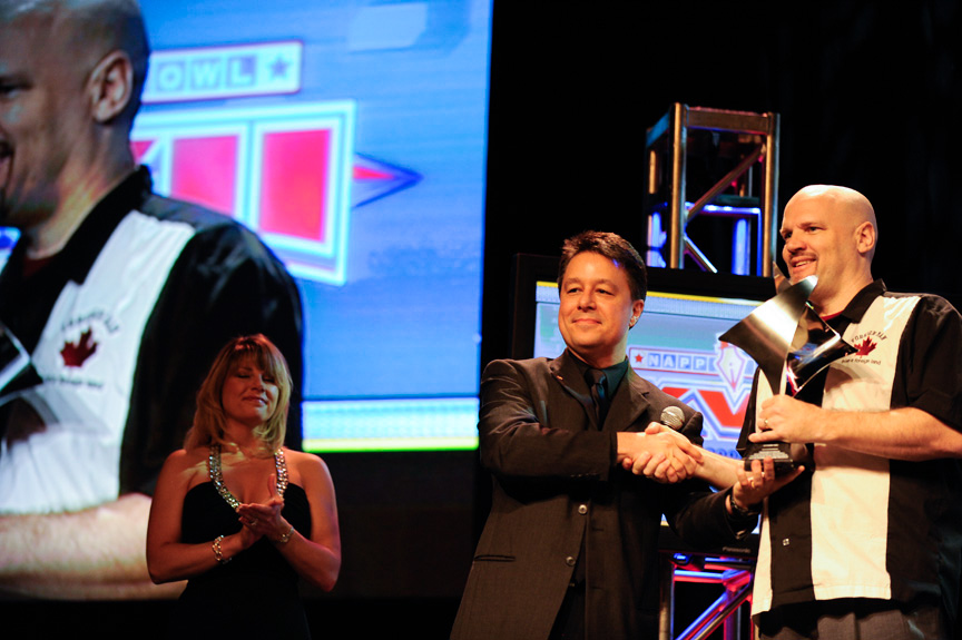 Dave (R) receiving his award from Larry Becker (L) during the Photoshop World Conference & Expo opening keynote presentation. 