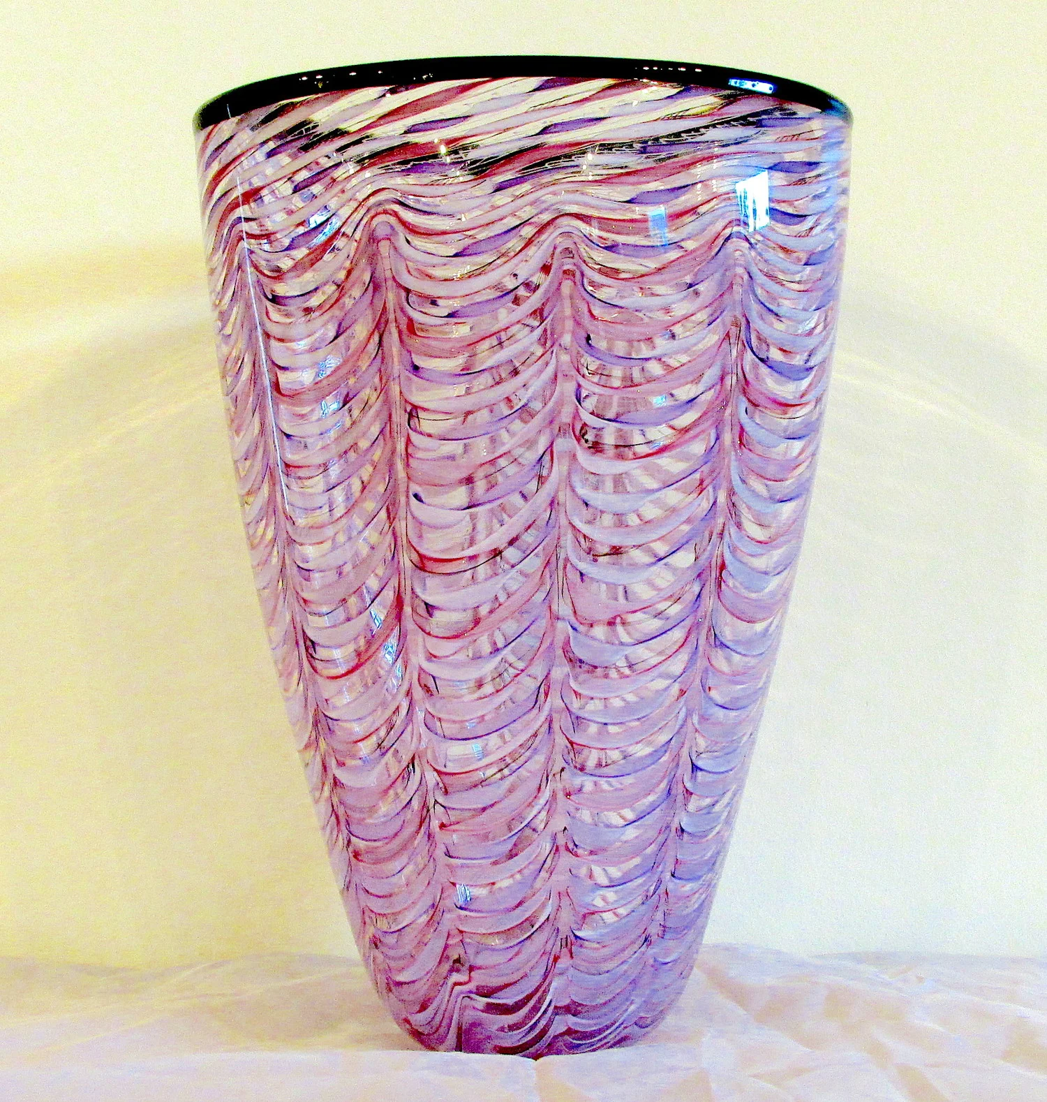 Brian Kerkvliet Brian's style is fairly diverse, encompassing many facets of glass art. However, the fun and whimsy expressed in his work shines throughout the entire spectrum of his pieces. From intimate cosmic and vessel beads to sculptural figurative goblets and the Cosmic Kid series, a joy for life and technical expertise is expressed in each and every piece. Brian has taken many age old classical glass working techniques and added his own contemporary, childlike enthusiasm and blended it together where it works to bring joyful glass into existence.