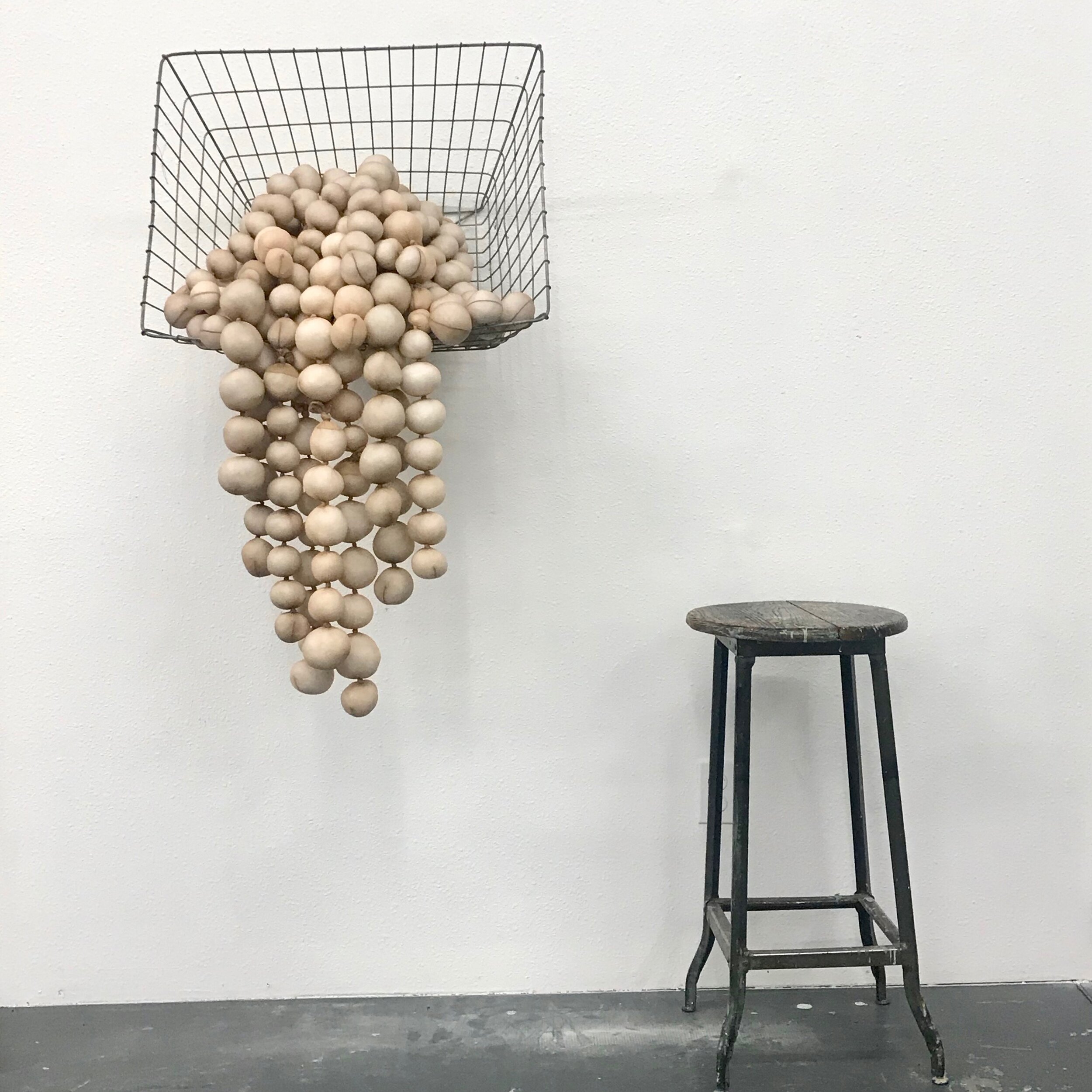Untitled (spilling basket of balls)