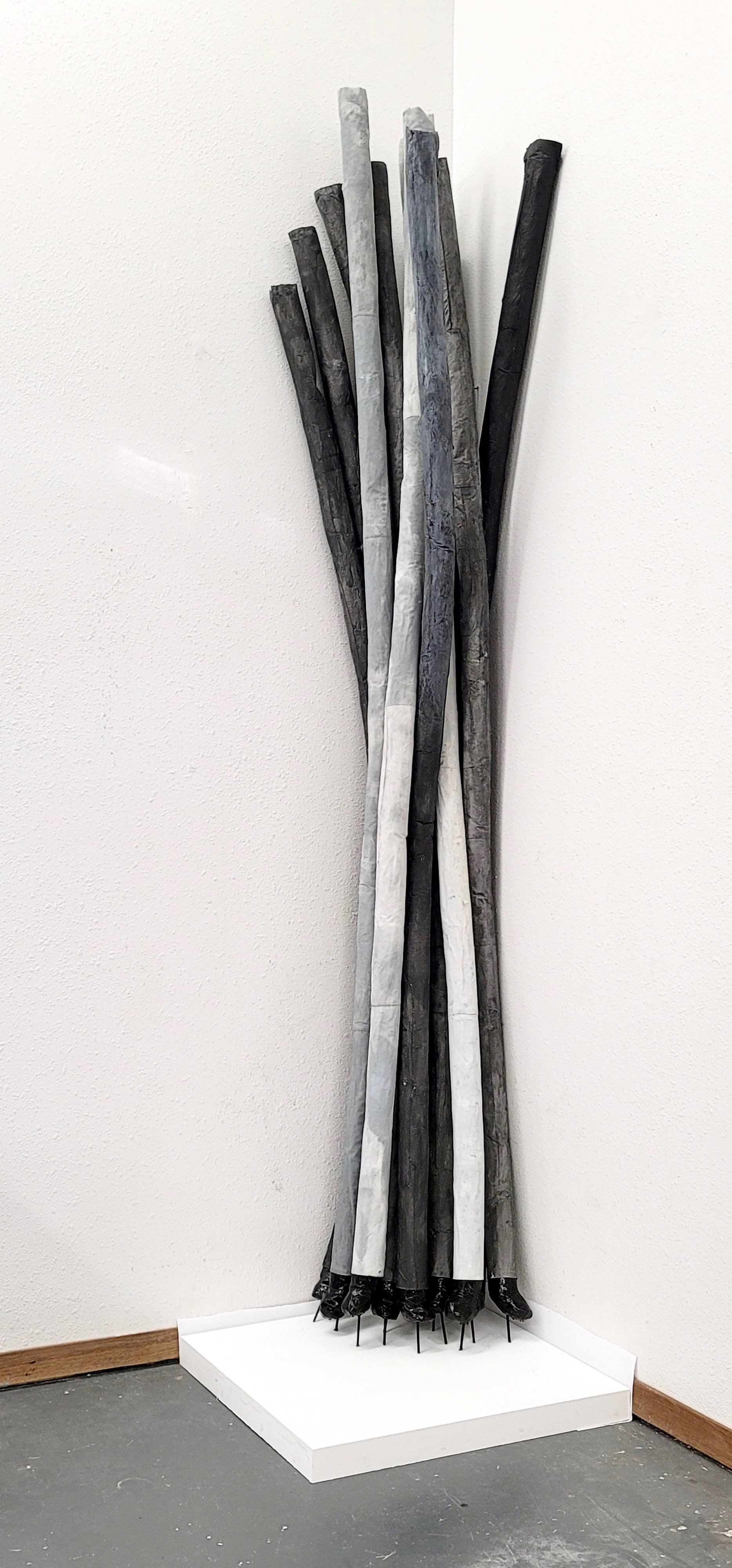 untitled (standing rods with feet)