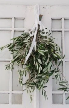 Create your own Christmas wreath or wall art with your own personal touch! All you need is some wire, branches, and outdoor greenery finds. Wire together branches and use little pieces of wire to join in the greenery. Add your wreath to your exterior door or make it a punch above your fireplace. Bring tiny touches of greenery wall art and make a vignette out of it by adding your existing Christmas décor with hints of natural pieces. 