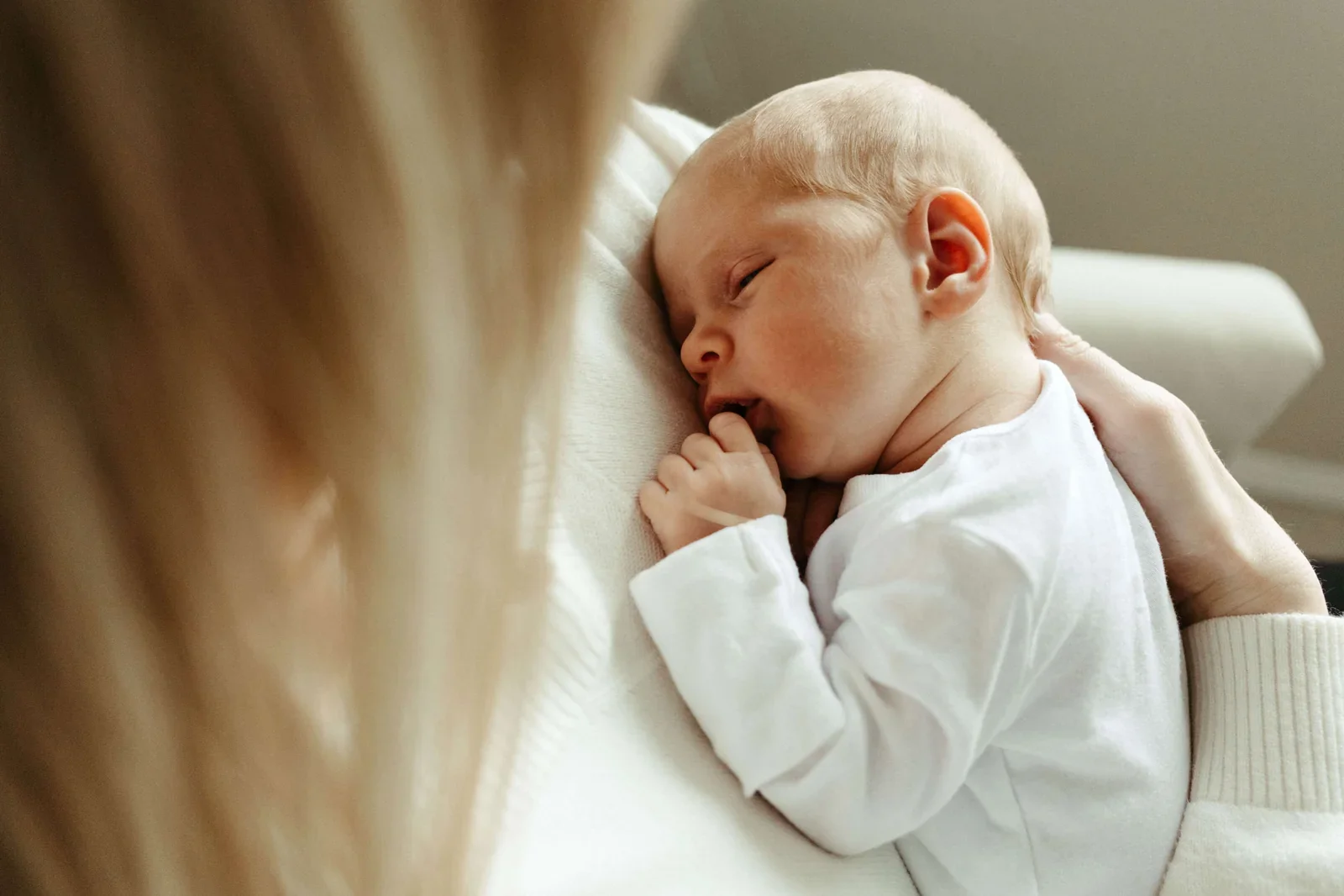 Portland doula holding a sleeping baby in her lap