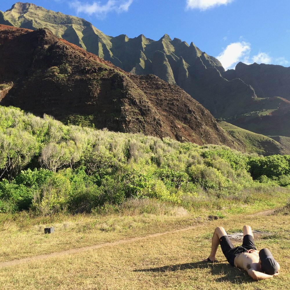   Joe resting and meditating upon the majestic pali (sea cliffs).  