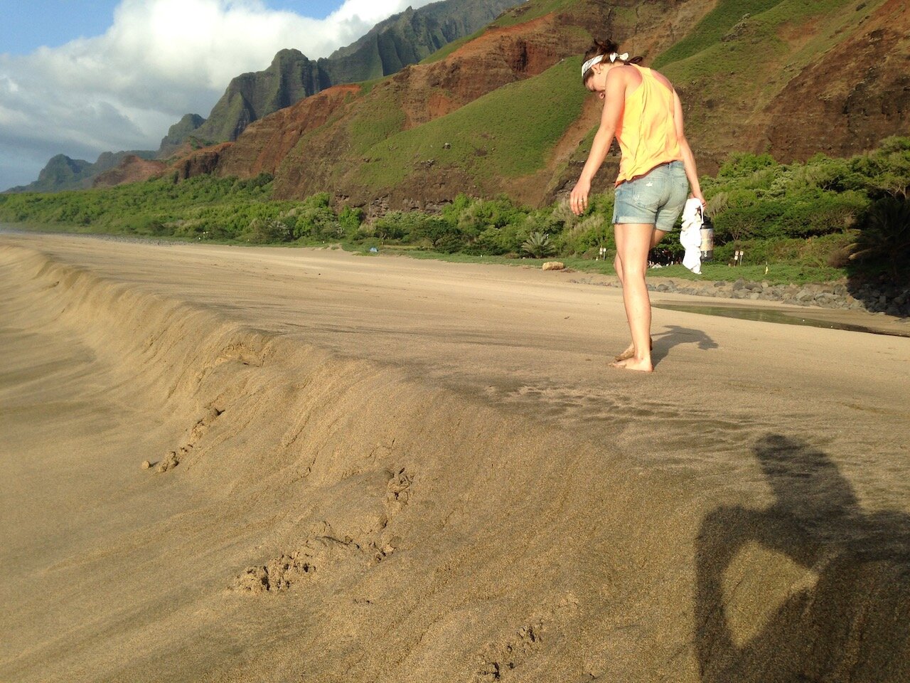   Ashleigh strolling along Kalalau Beach.  