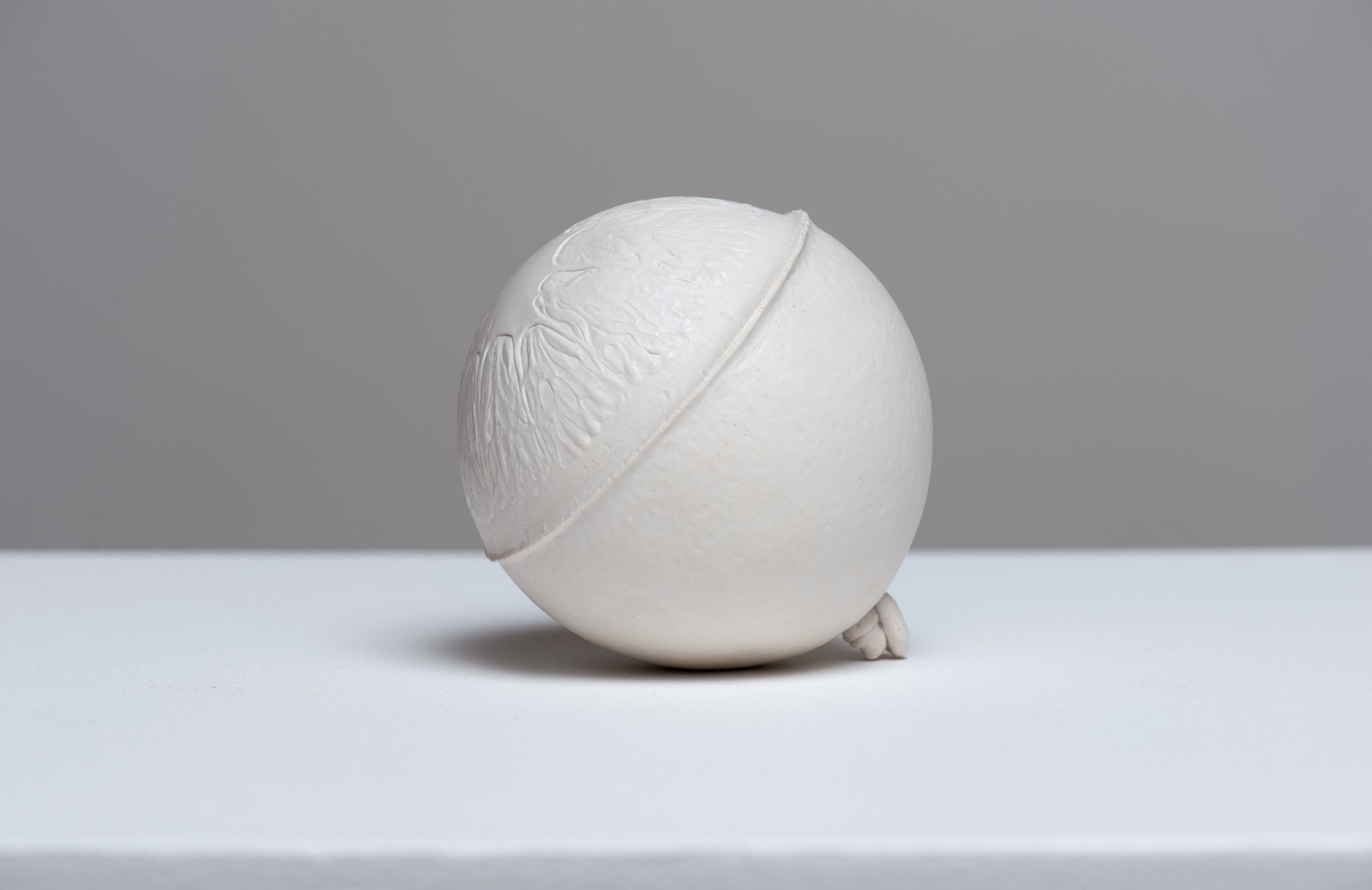  SIDE VIEW  Navel , 2017 Gypsum cement, and porcelain dust 3 1/2 inches (round) 