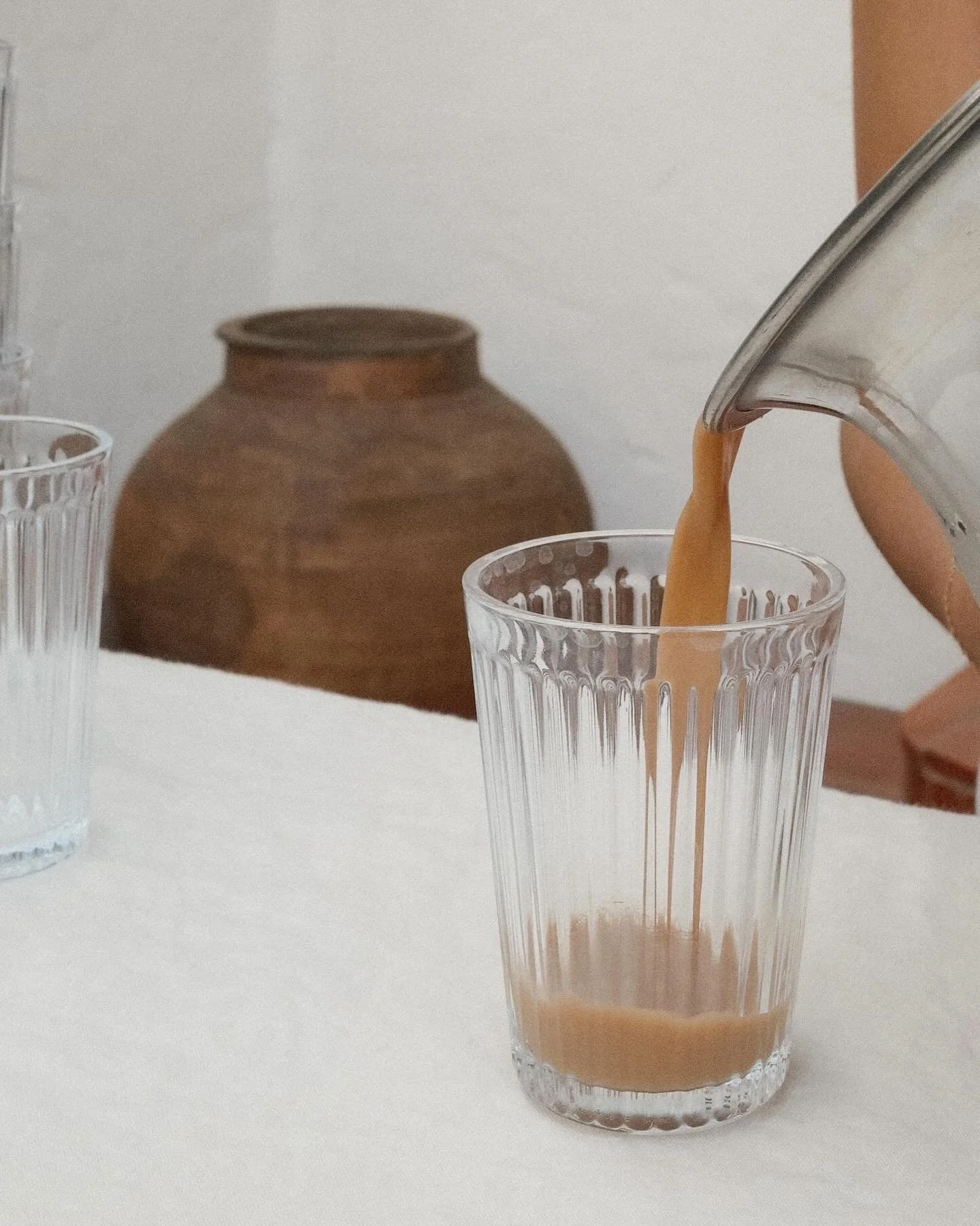 warmer days call for iced chai 🤎

only a handful of our house blend tins left &mdash; dm to order :) aaja chai can be served hot or cold.

first image: iced chai with cashew coconut milk taken by  @h__fielder