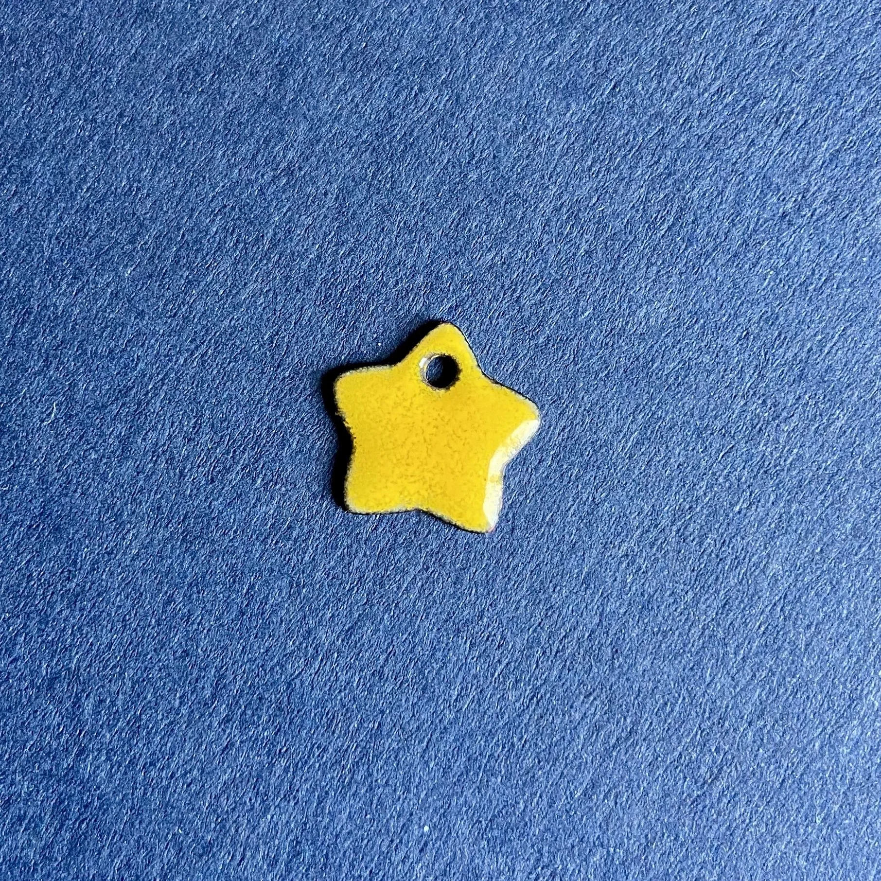 yellow star charm.jpg