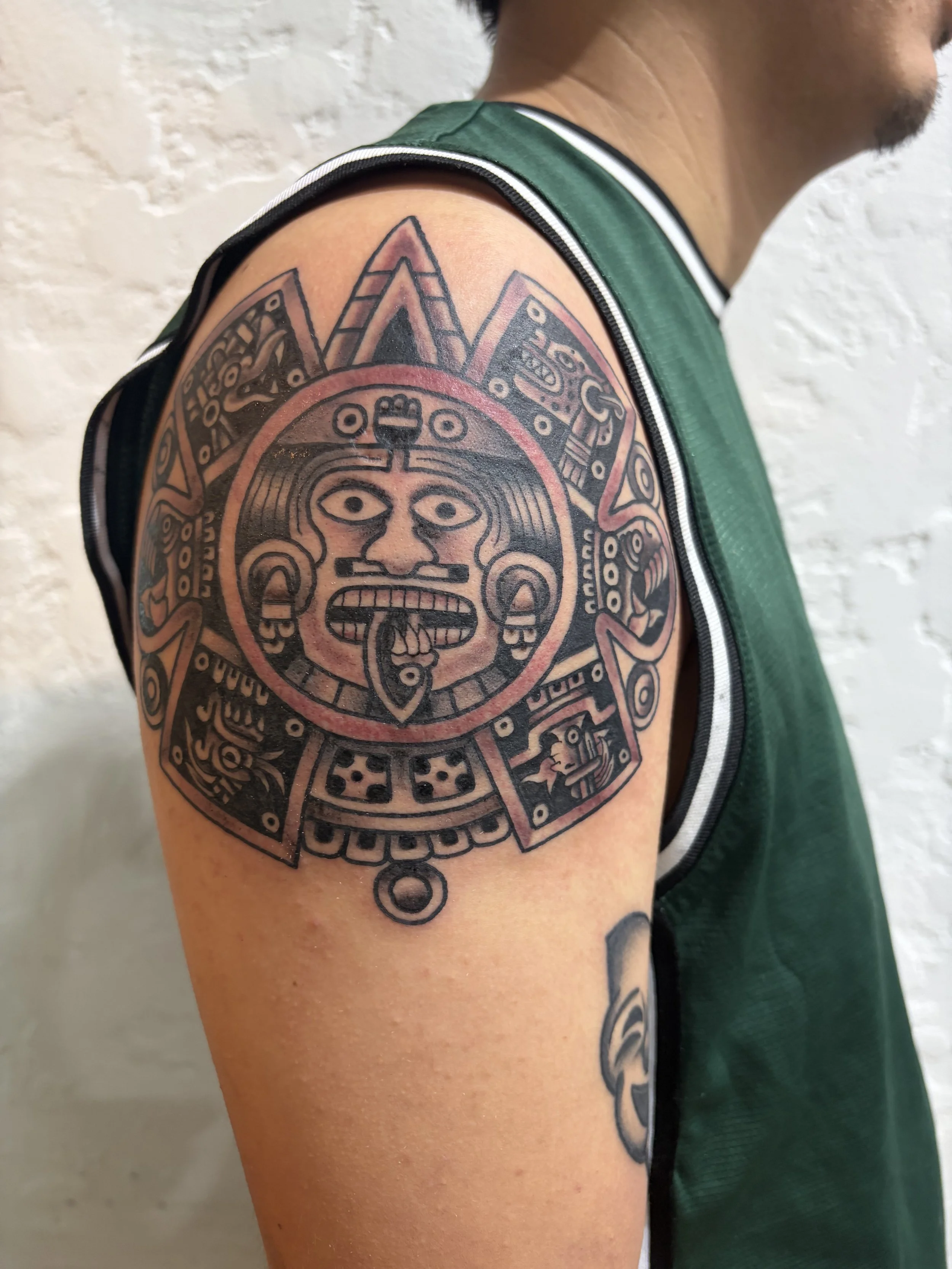 mexica aztec sun  by robert nava at Superfly Tattoo in San Diego, California
