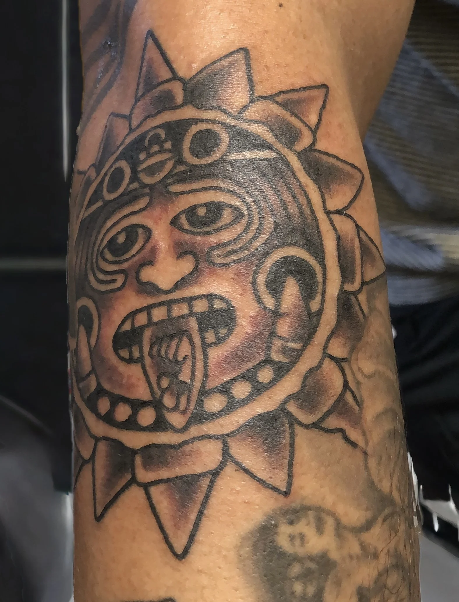 mexica aztec sun tattoo by robert nava at Superfly Tattoo in San Diego, California